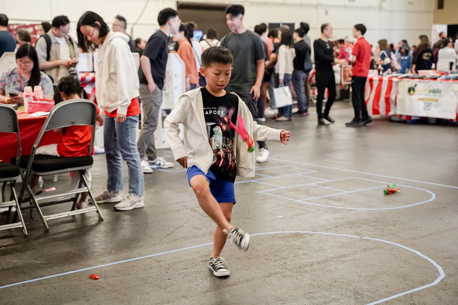 Child playing chapteh at the festival